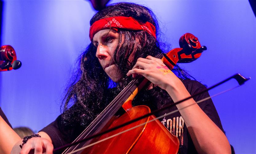 Orchestra students perform onstage